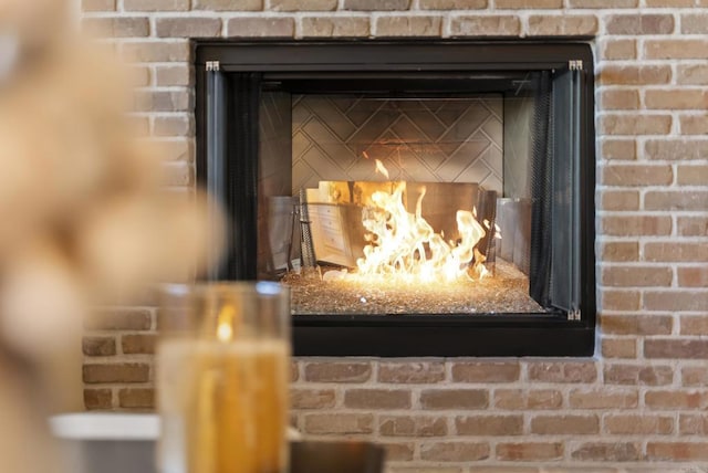 interior details with a brick fireplace