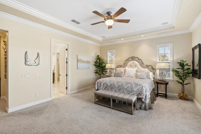 bedroom featuring visible vents, baseboards, ornamental molding, carpet, and a raised ceiling