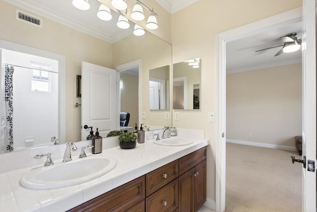 bathroom with double vanity, ornamental molding, a sink, and visible vents