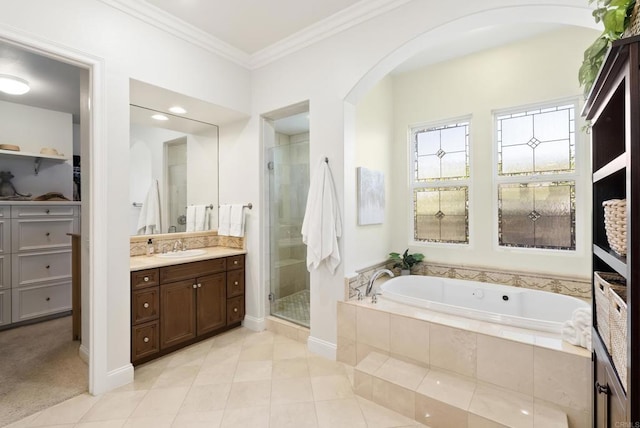 full bath featuring tile patterned floors, a garden tub, crown molding, vanity, and a shower stall