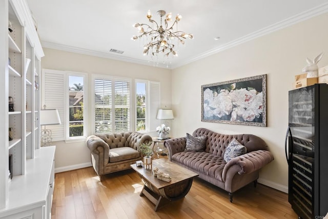 living area featuring light wood-style floors, visible vents, and crown molding