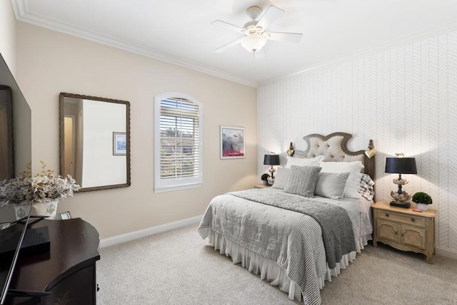 bedroom featuring baseboards, ornamental molding, a ceiling fan, and light colored carpet