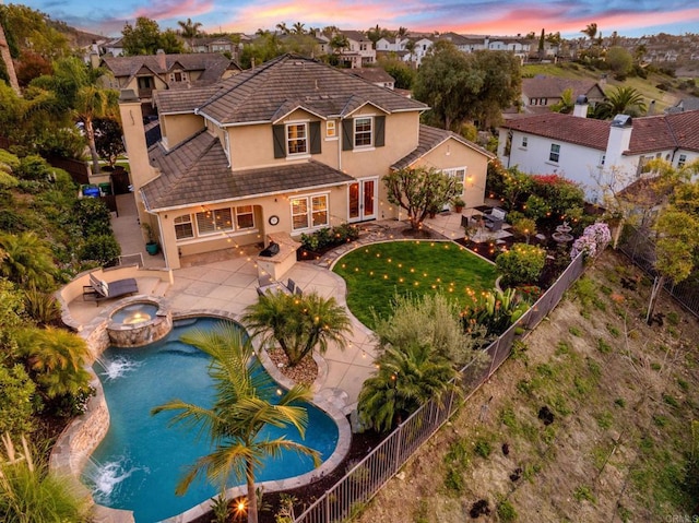 aerial view at dusk with a residential view