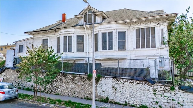 view of side of property with fence