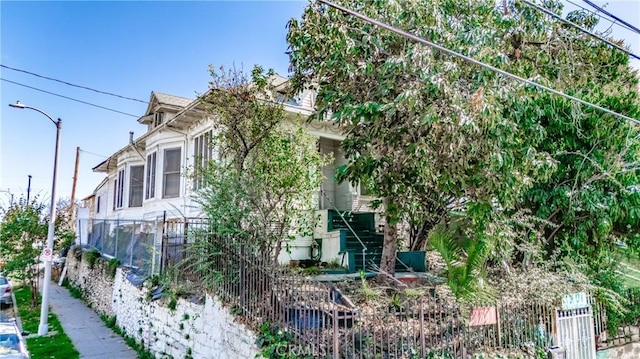 view of side of property with fence