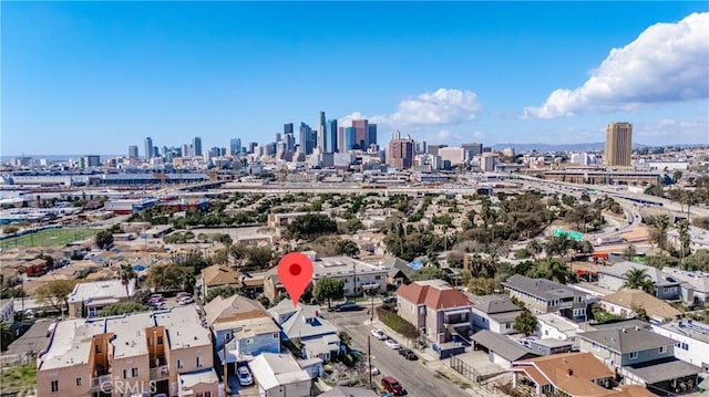 birds eye view of property with a view of city