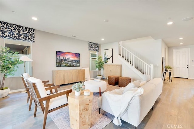 living room with light hardwood / wood-style flooring