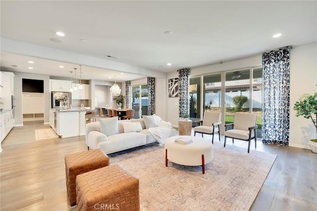 living room with light hardwood / wood-style floors