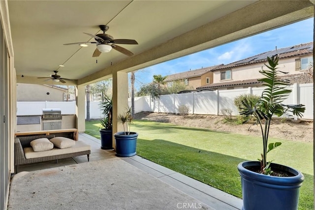 view of patio / terrace with a grill and ceiling fan