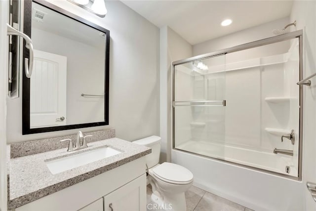 full bathroom featuring tile patterned floors, vanity, toilet, and enclosed tub / shower combo