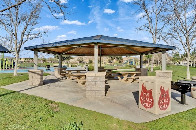 surrounding community with a yard and a gazebo