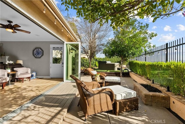 view of patio with a fenced backyard, outdoor lounge area, and a deck