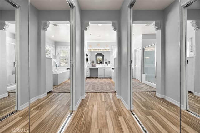 2503 N San Miguel Dr, Orange, CA 92867 - hall featuring light wood-style flooring and baseboards