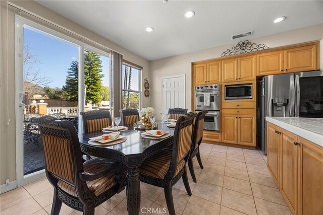 2503 N San Miguel Dr, Orange, CA 92867 - dining room with recessed lighting and light tile patterned floors