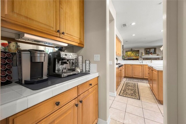 2503 N San Miguel Dr, Orange, CA 92867 - kitchen with light tile patterned floors, plenty of natural light, recessed lighting, and tile counters