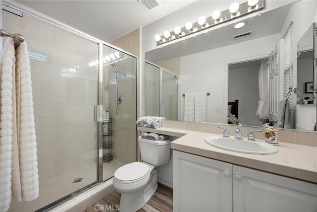 2503 N San Miguel Dr, Orange, CA 92867 - full bathroom featuring toilet, ensuite bath, vanity, a shower stall, and wood finished floors
