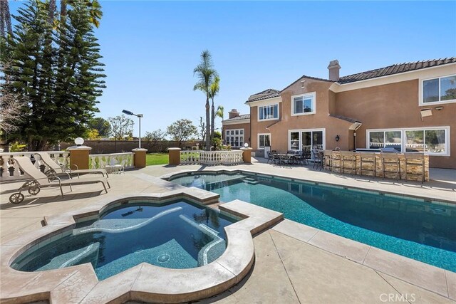 2503 N San Miguel Dr, Orange, CA 92867 - view of pool featuring a pool with connected hot tub and a patio