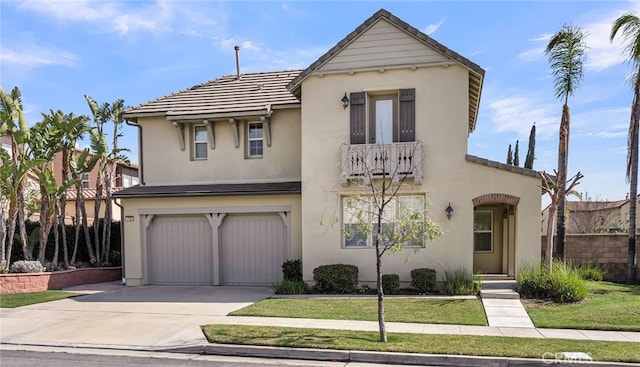 view of front of house with a garage and a front lawn