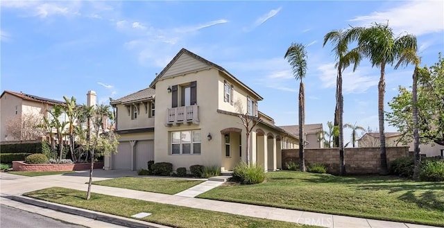 view of front of property featuring a garage and a front yard