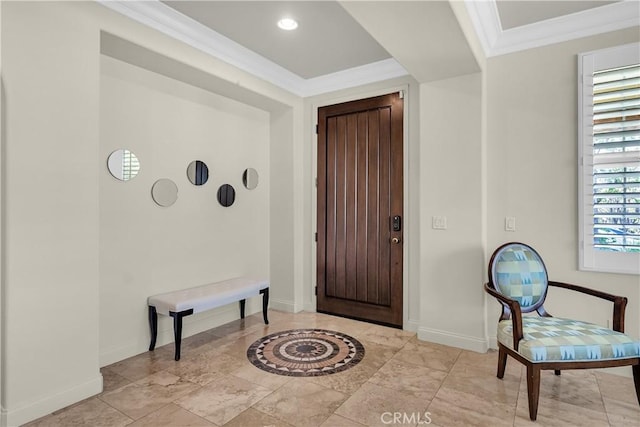 foyer entrance featuring crown molding