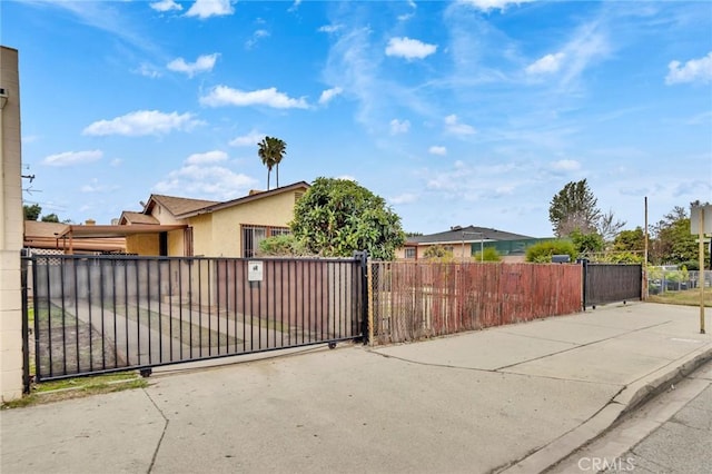 view of gate with fence