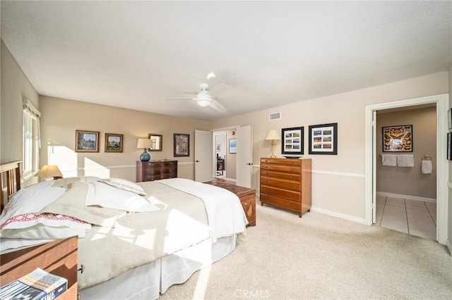 bedroom with ceiling fan and light colored carpet