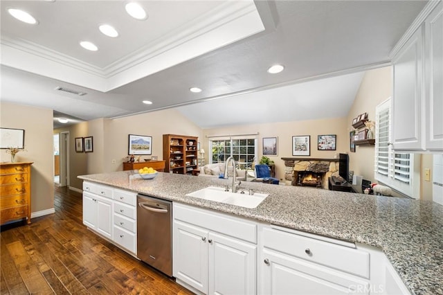 kitchen with lofted ceiling, sink, white cabinetry, dishwasher, and dark wood-type flooring