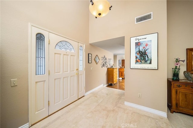 foyer featuring a high ceiling