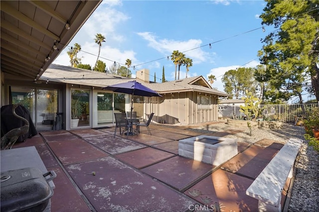 view of patio / terrace featuring fence