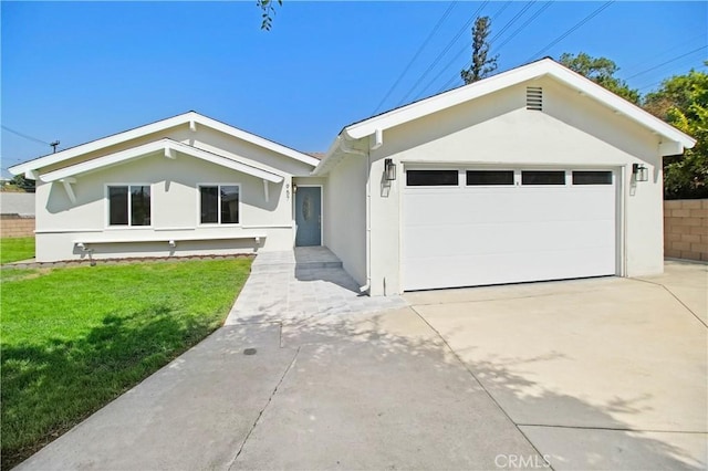 single story home featuring a garage and a front yard