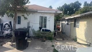 rear view of property featuring a patio area