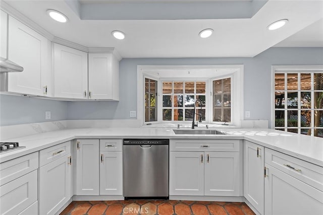 kitchen featuring sink, white cabinetry, a healthy amount of sunlight, and dishwasher