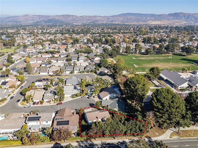 birds eye view of property featuring a mountain view