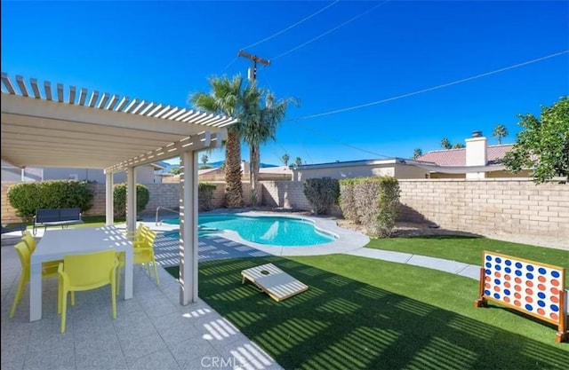 view of swimming pool featuring a pergola, a lawn, and a patio area