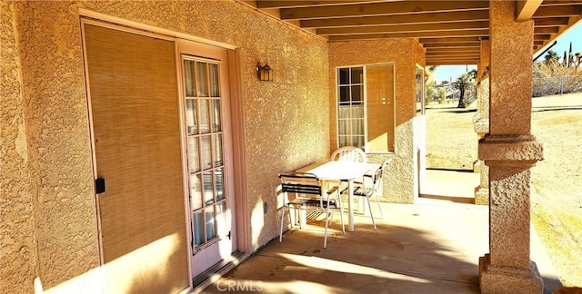 view of patio / terrace featuring fence