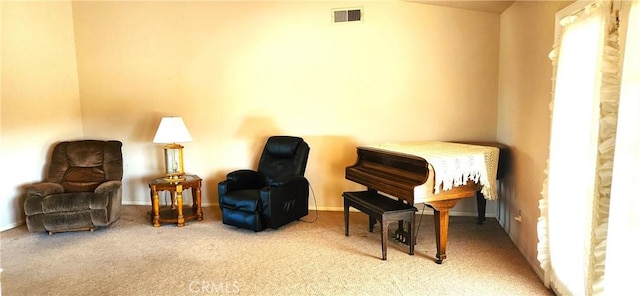 sitting room with carpet and visible vents