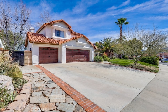 mediterranean / spanish house featuring a garage