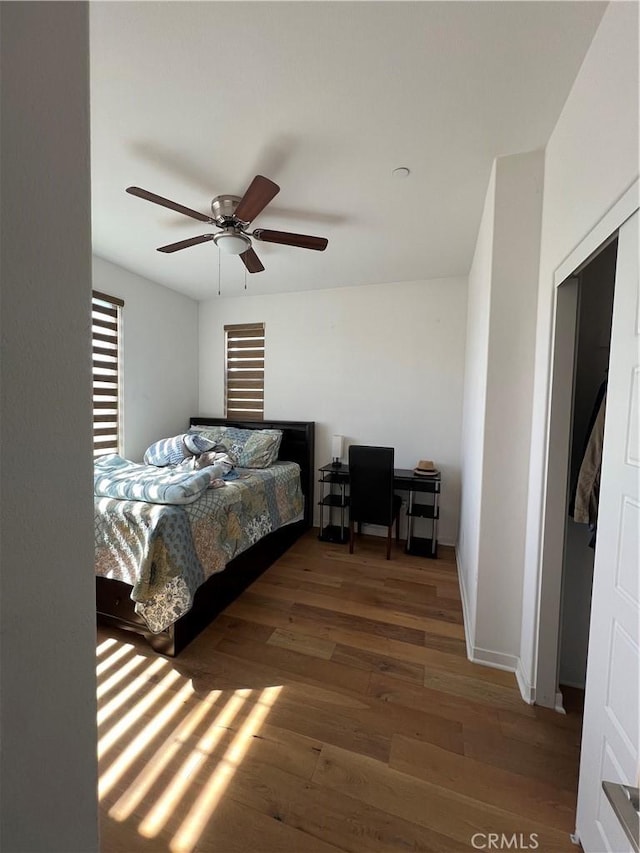 bedroom featuring ceiling fan and wood finished floors