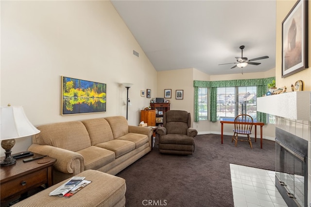 carpeted living room featuring baseboards, visible vents, high vaulted ceiling, and ceiling fan