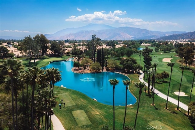 view of pool featuring a yard, golf course view, and a water and mountain view