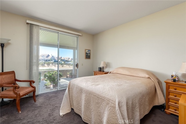 bedroom with dark colored carpet and access to outside