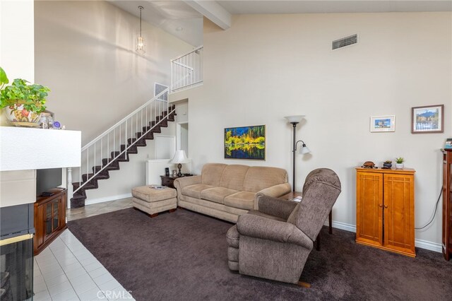 tiled living room with baseboards, visible vents, high vaulted ceiling, stairs, and beamed ceiling