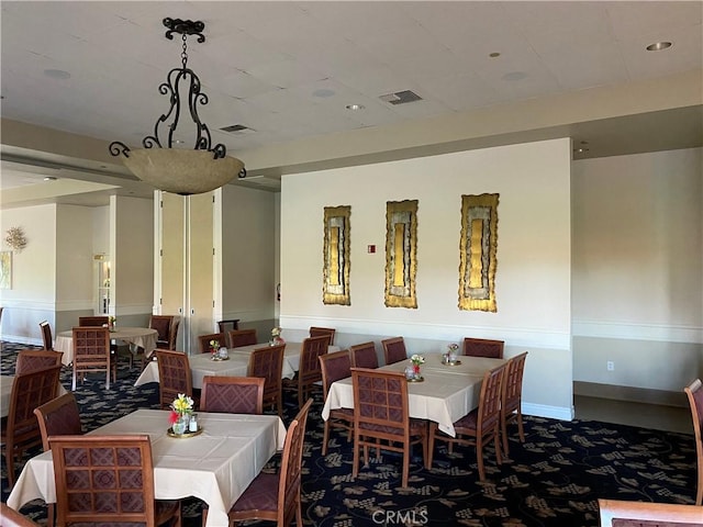 dining space with recessed lighting, baseboards, and visible vents