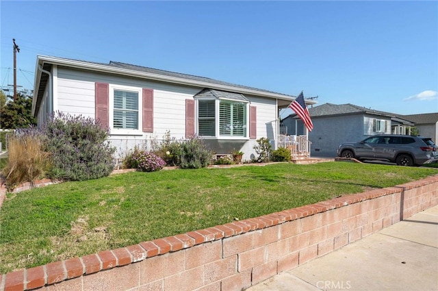 view of front of home with a front yard