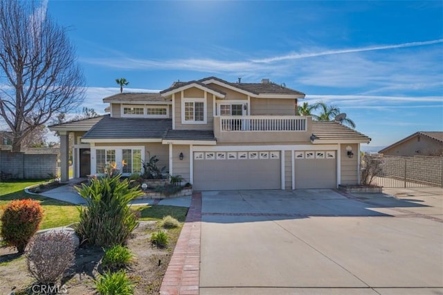 view of property with a garage and a balcony