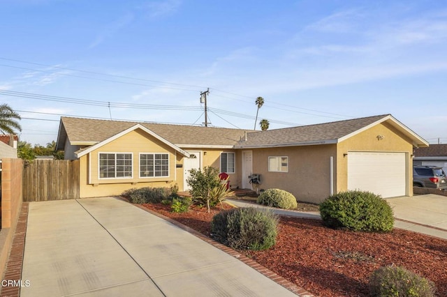 ranch-style home with a garage, fence, concrete driveway, and stucco siding