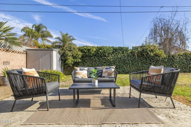 view of patio / terrace with fence and an outdoor hangout area