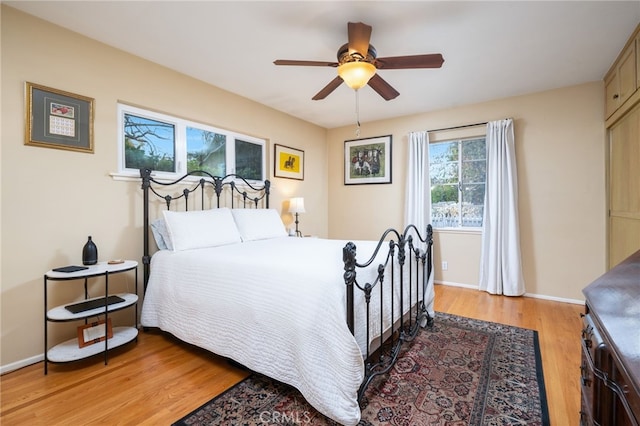 bedroom featuring ceiling fan and light hardwood / wood-style floors