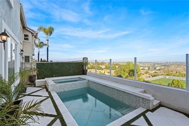 view of swimming pool featuring an in ground hot tub