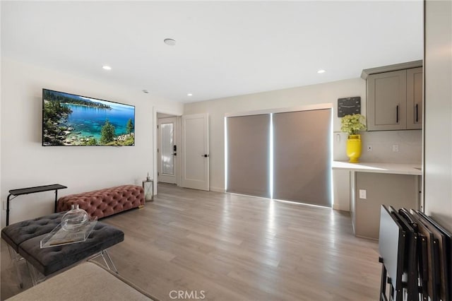 living room with light hardwood / wood-style flooring